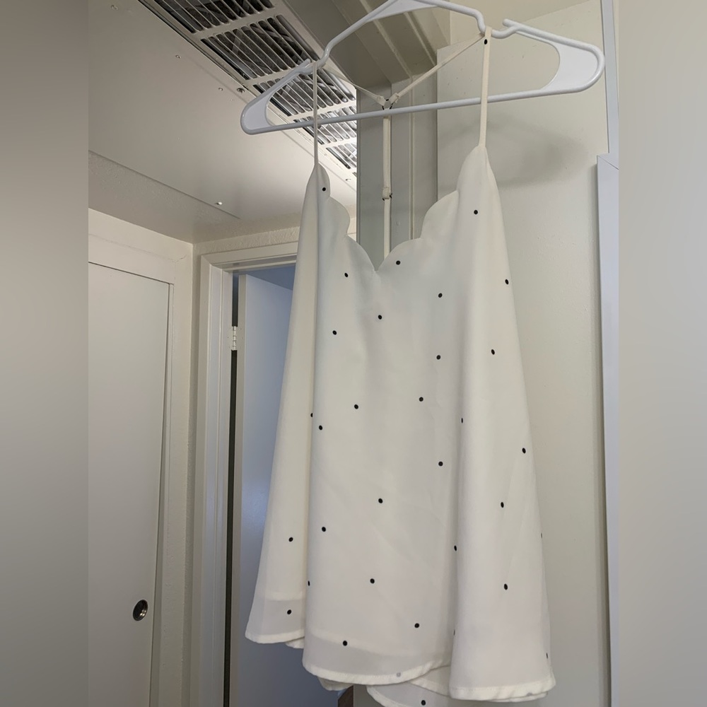white top with black dots, scallop detail, adjustable racerback strap. medium
